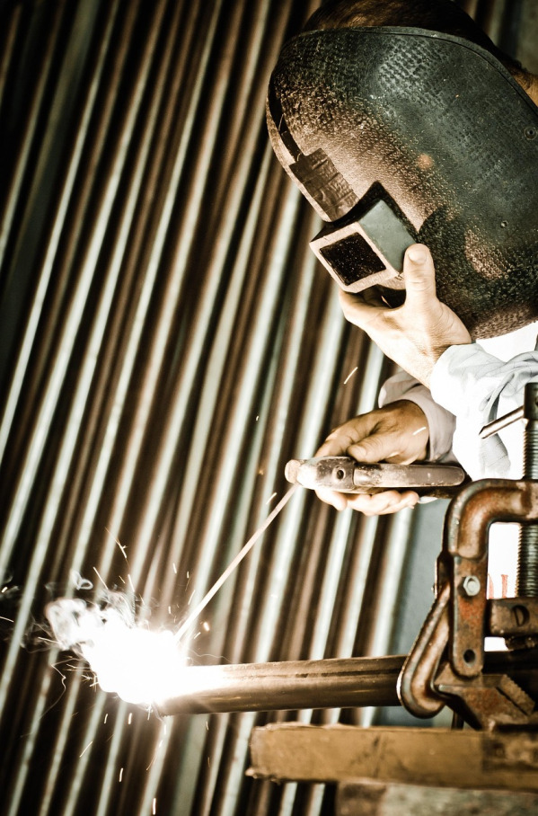 welding helmet and sparks close up