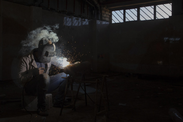 welder at work with sparks